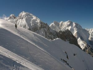 Marko Prezelj descends from an acclimatization climb in the Karakoram Range, Pakistan. K7 and K6 loom behind. Photo by Steve House